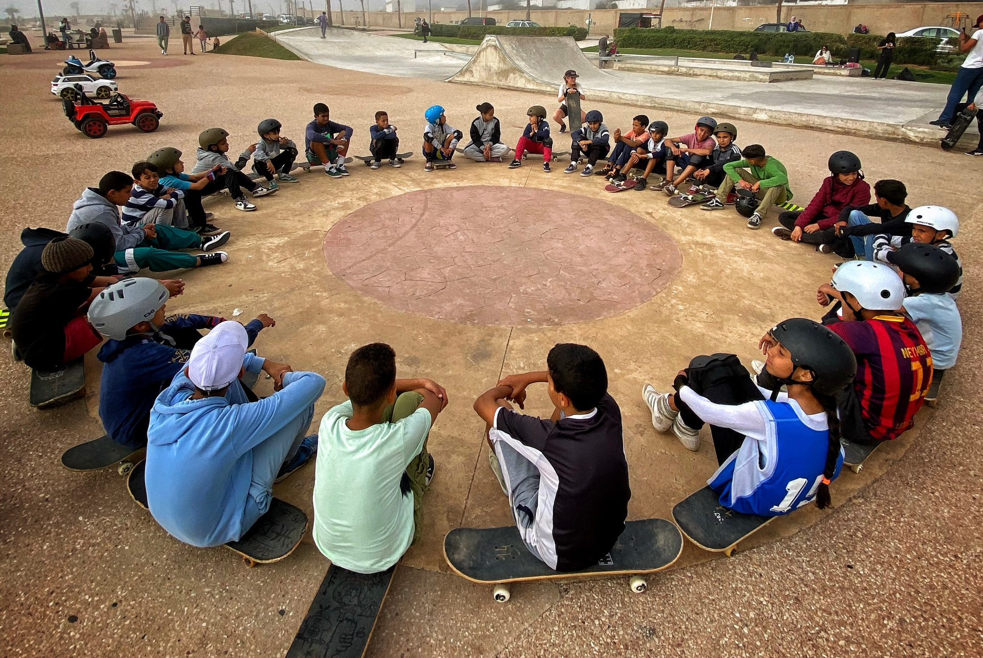 Children taking part in a JOY Empowerment activity with Casa Skate Club