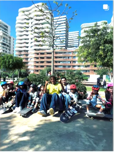 Group of skaters sitting on skateboards in a Casablanca park